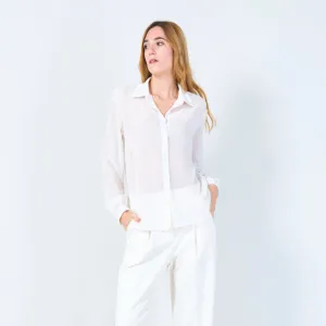 Sheer button-up blouse with polka dot accents wholesale