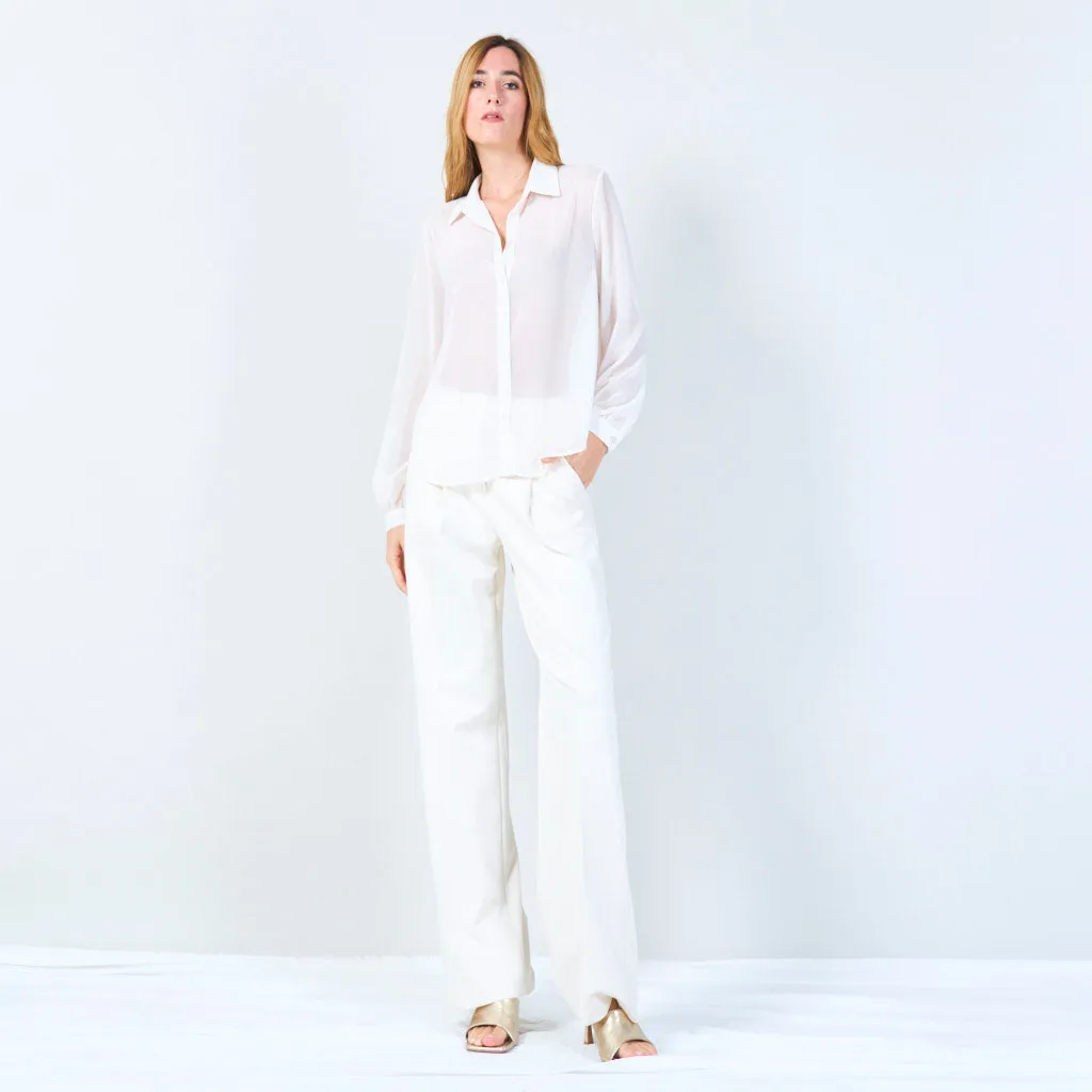 Sheer button-up blouse with polka dot accents wholesale